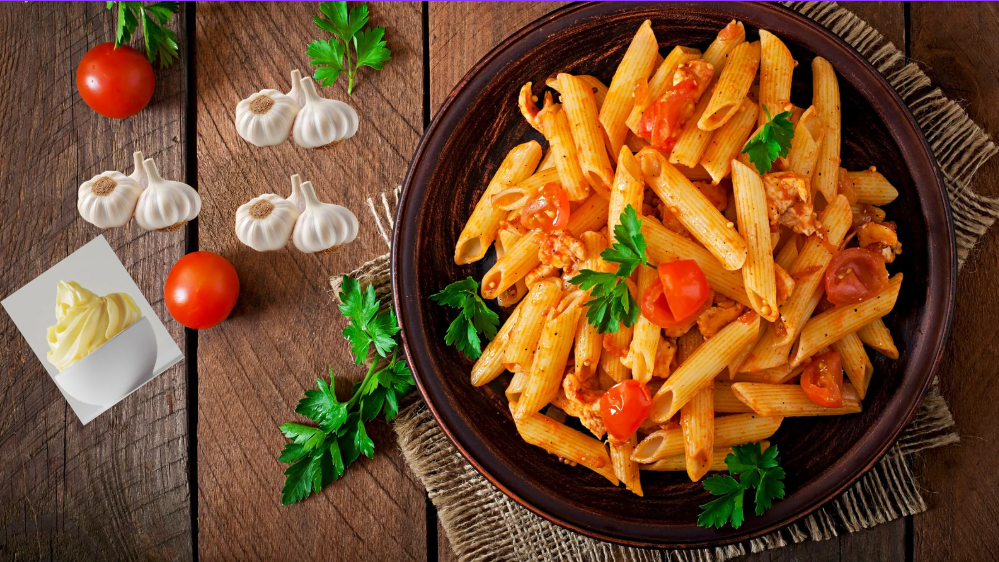 Creamy garlic butter pasta served on a plate with grated cheese and herbs