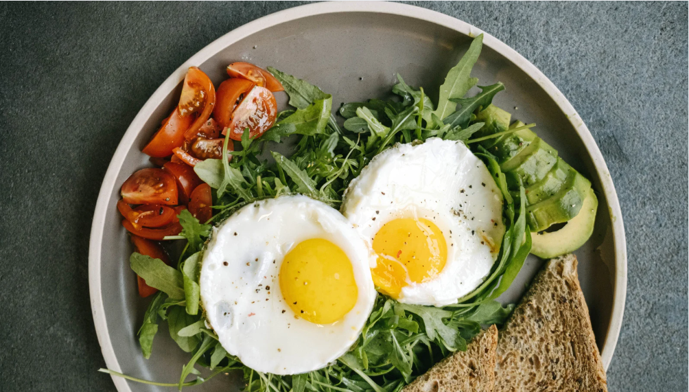 Golden baked Sausage and Egg Breakfast Casserole in a baking dish, topped with melted cheese