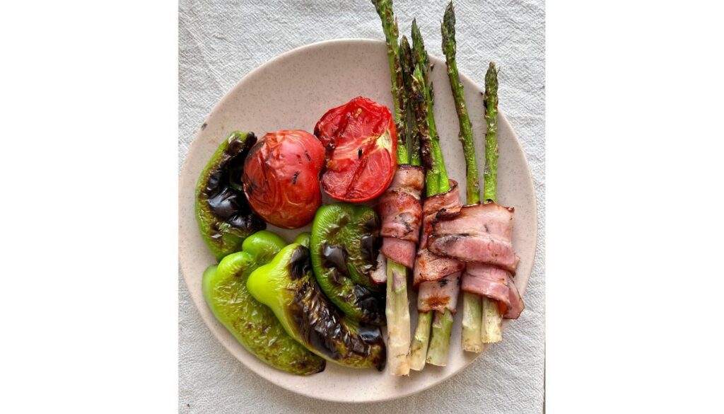 Crispy brown sugar candied bacon served with pancakes and eggs for breakfast.
