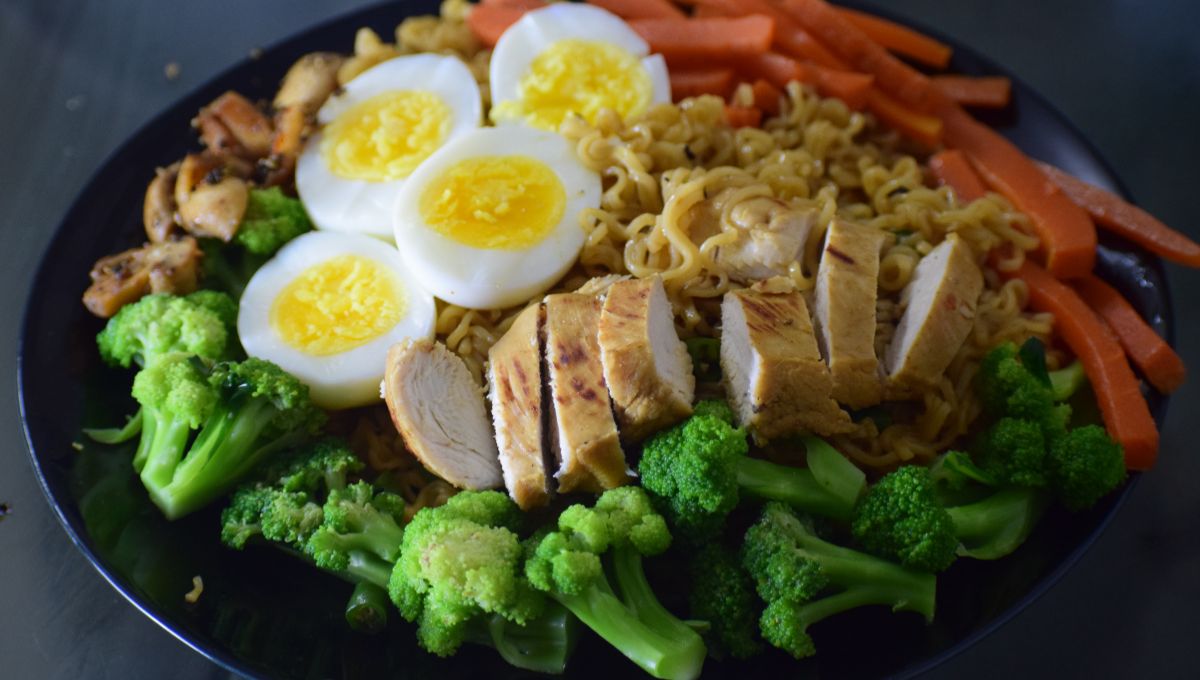 Colorful plate of budget-friendly meals including pasta, rice, eggs, and vegetables for under $10 – easy and healthy budget meals.