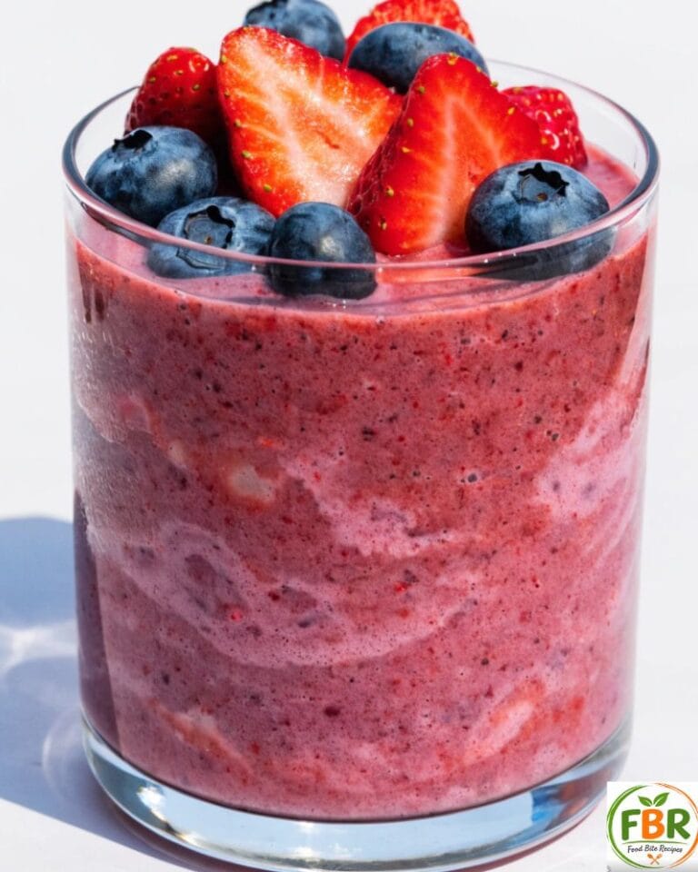 Healthy mixed berry smoothie for weight loss made with strawberries, blueberries, and chia seeds in a glass