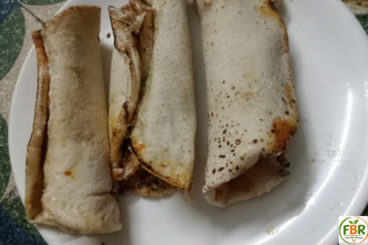 Three juicy chicken shawarma wraps served on a white plate - Food Bite Recipes