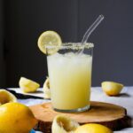 Homemade electrolyte drink recipe made with fresh lemon, water, and natural salt served in a glass