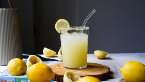 Homemade electrolyte drink recipe made with fresh lemon, water, and natural salt served in a glass