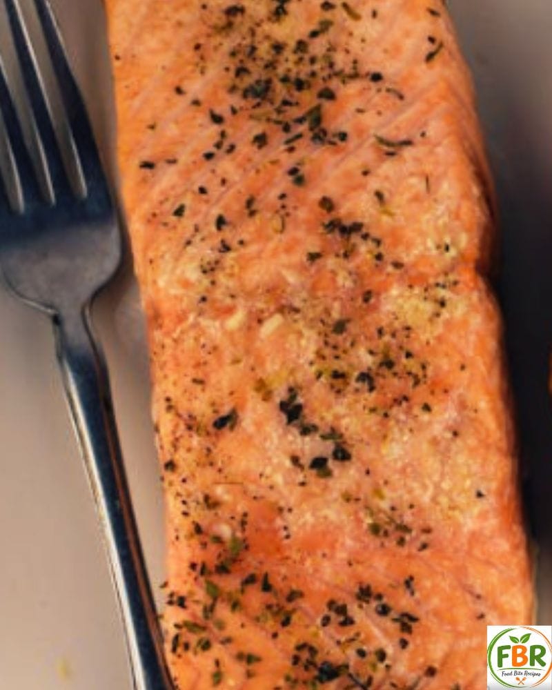 crispy air fryer salmon bites recipe served with lemon and herbs