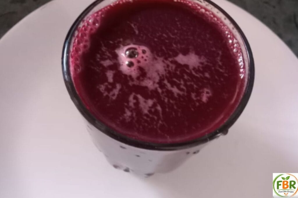 Top view of amla beetroot carrot juice showing natural texture and color