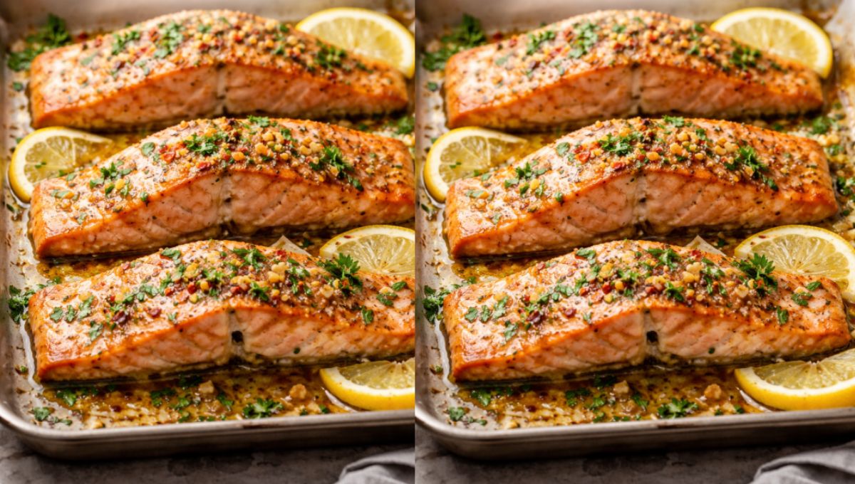 Perfectly baked salmon fillets glazed with garlic butter, garnished with fresh parsley and lemon slices, served on a white baking tray, ready to eat.