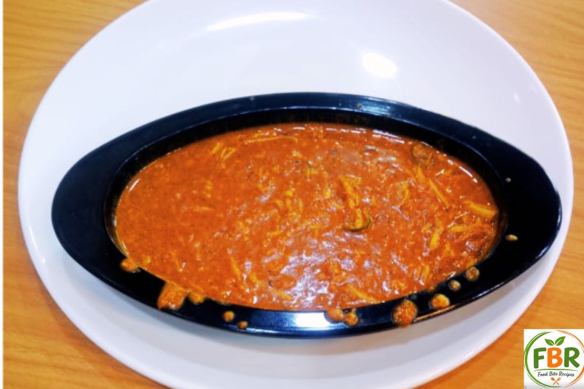A rich and creamy bowl of homemade Butter Chicken Curry (Murgh Makhani) served in a black dish.