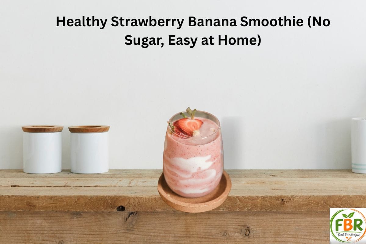 Healthy Strawberry Banana Smoothie without sugar in a glass on a wooden table.