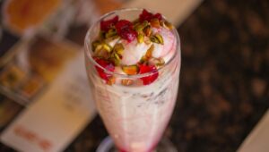 Kulfi falooda recipe with rose syrup, basil seeds, and pistachios