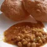 Easy Chole Bhature Recipe with crispy bhature and spicy Punjabi chickpea curry